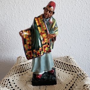Porcelain Statue" Carpet Seller"by Royal Dulton. Designer Leslie Harradi…